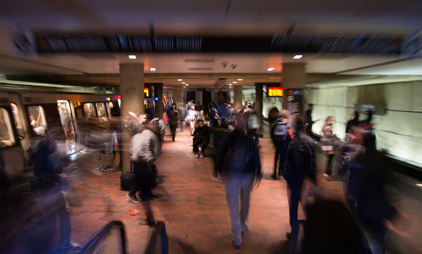 Riders moving through busy WMATA train station