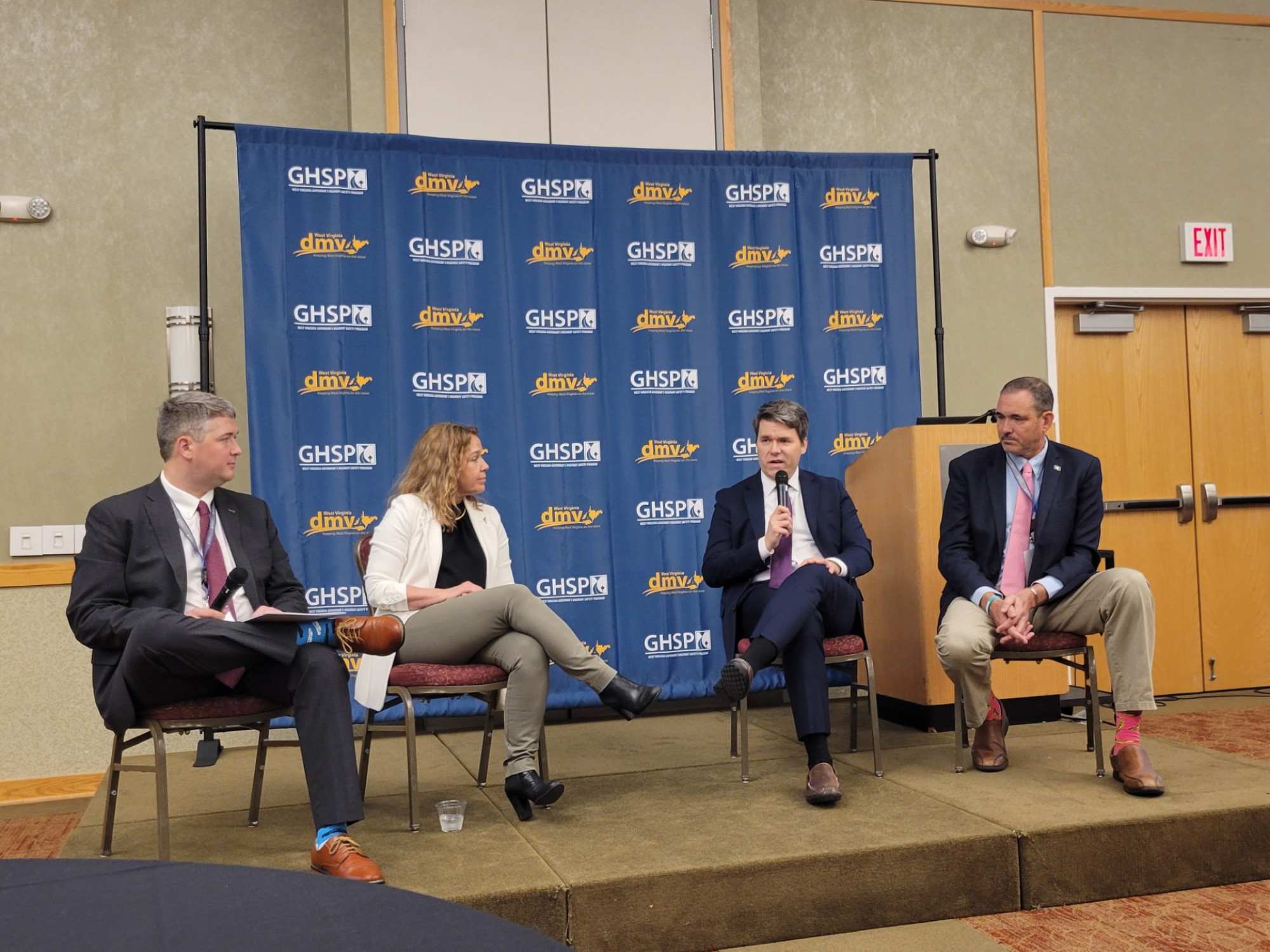 Rick Birt, Director of the DC Highway Safety Office; Russ Martin, Senior Associate at Cambridge Systematics; and Greg Puckett, Executive Director at Community Connections, speaking at a panel, moderated by Shannon Hughes, Founder of Own Our Streets.